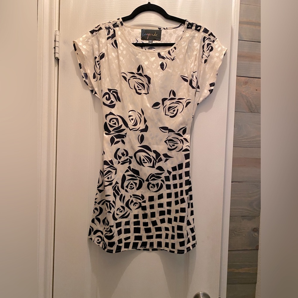 Super cute silky cream and black cocktail dress!